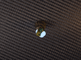 A chest bursts and showers loot items that bounce and settle on the ground.